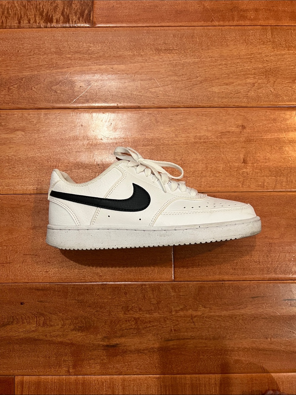 Nike White Low-Top Sneaker with Black Swoosh Accent